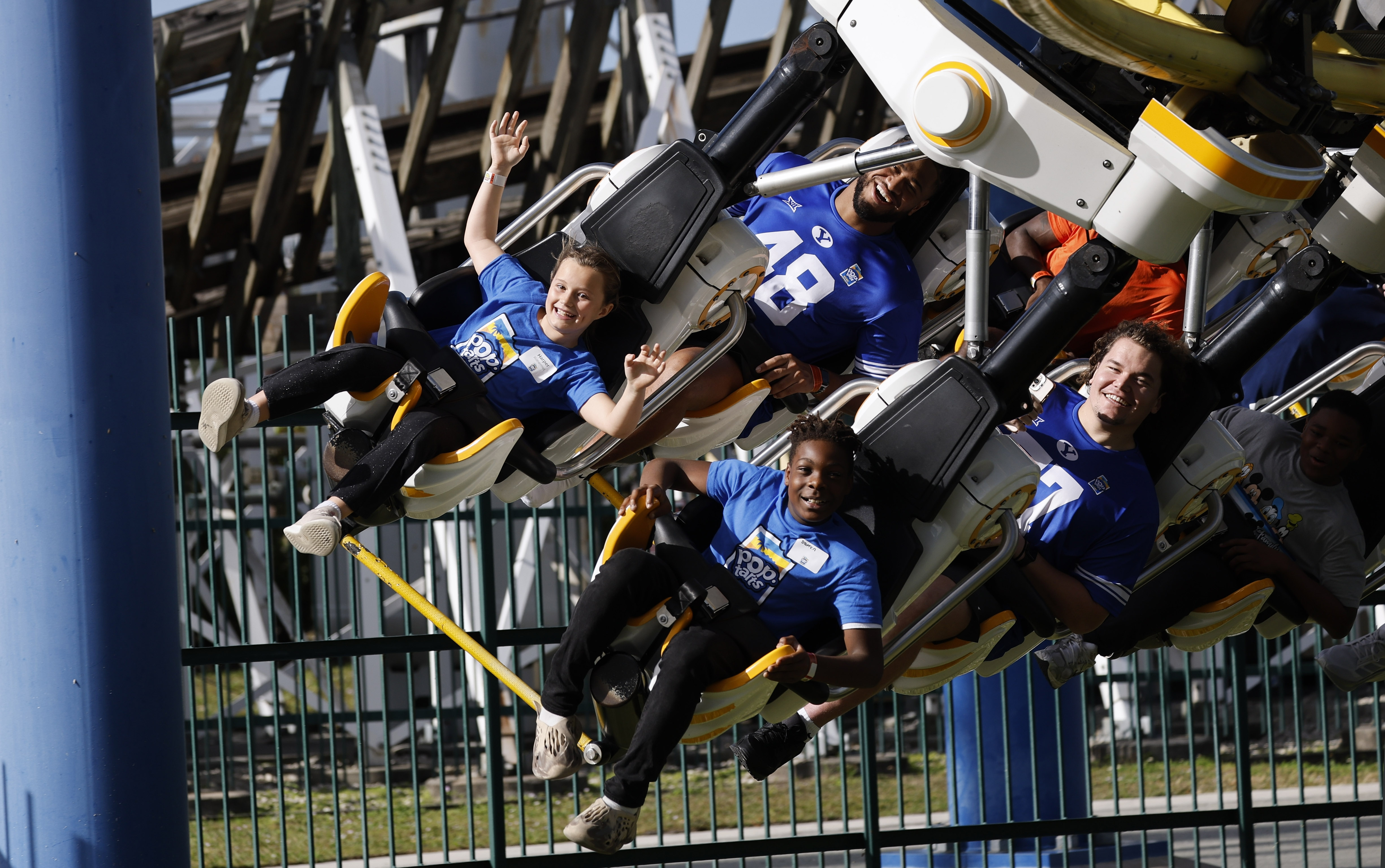 Football players and central Florida children ride the Freedom Flyer...