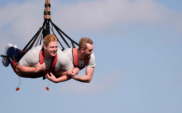 Left to Right, Georgia Tech DL Jordan Van Den Berg, and QB Haynes King wait to ride the SkyCoaster during kids day for the 36th annual Pop-Tarts Bowl, at Fun Spot America, on Tuesday, December 23, 2025. (Ricardo Ramirez Buxeda/Orlando Sentinel)