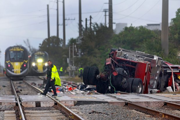 A Brightline train collided with a fire truck at East Atlantic Avenue and Southeast First Avenue in downtown Delray Beach on Saturday afternoon, Dec. 28, 2024. After long delays, Brightline is converting more intersections to "sealed crossings" that prevent most vehicles from encroaching on occupied tracks. (Mike Stocker/South Florida Sun Sentinel file)