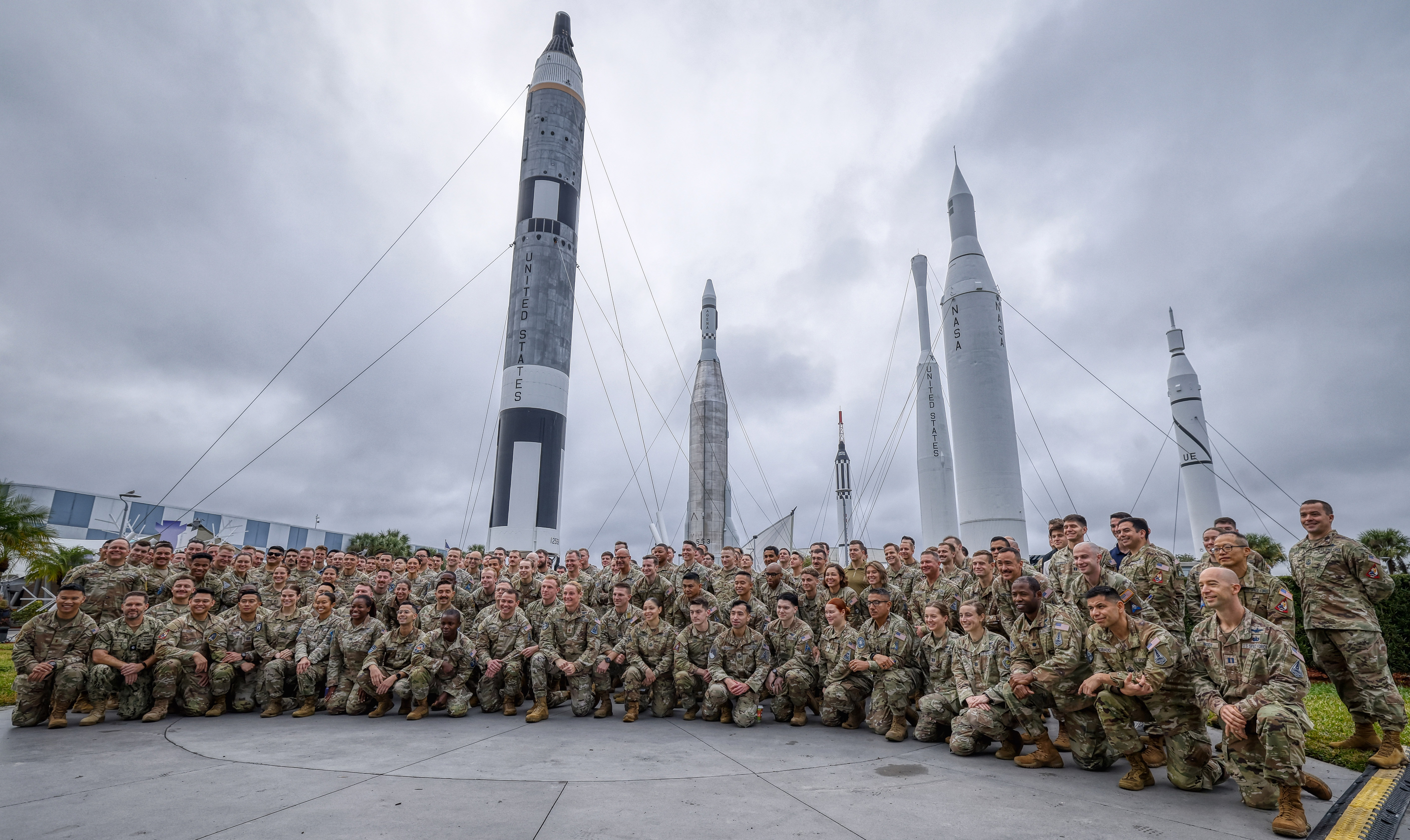 Participants pose for a photo before the opening ceremony for...