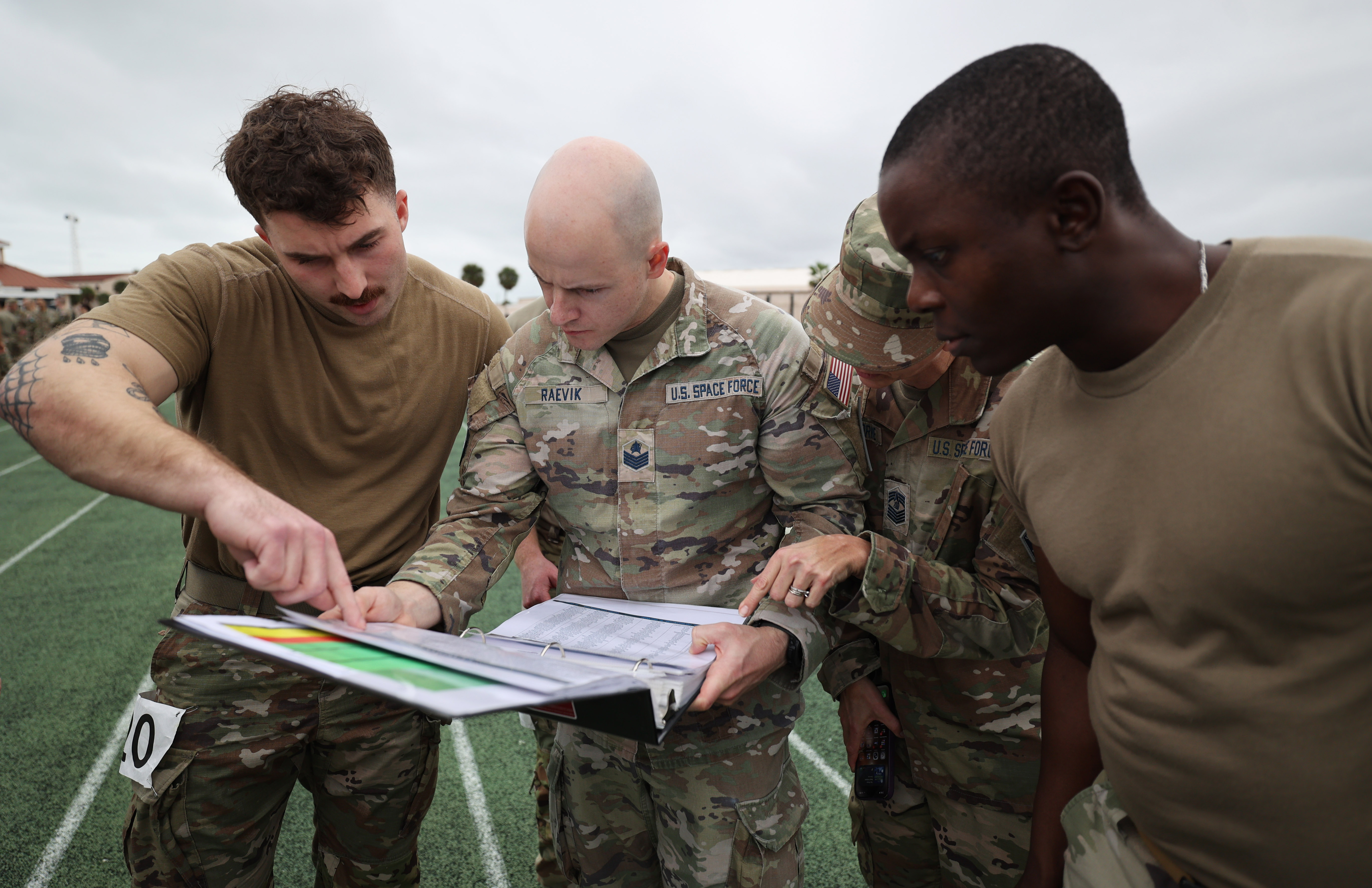Participants look for their team start times during the first...