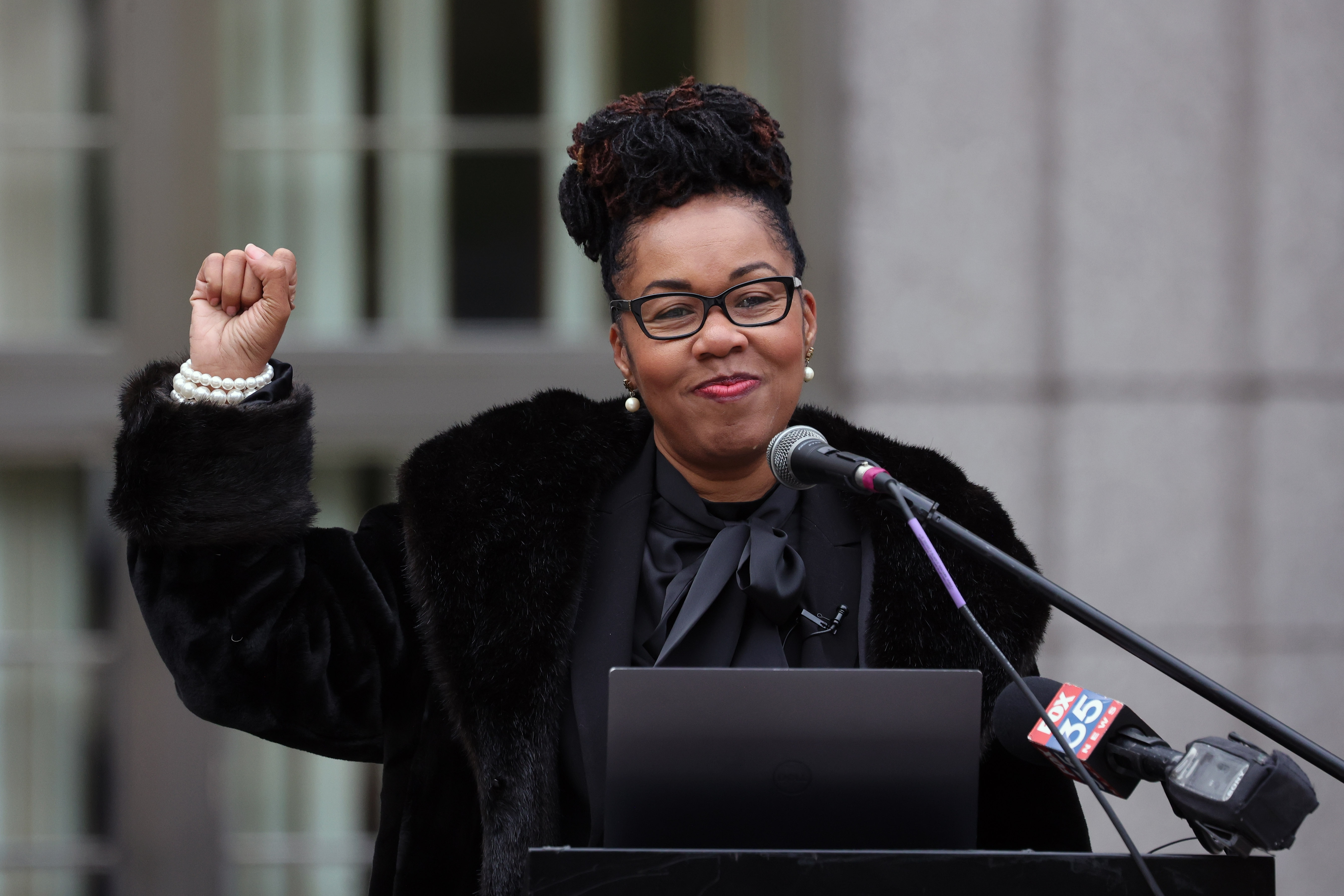Orange-Osceola State Attorney Monique Worrell holds a fist up as...