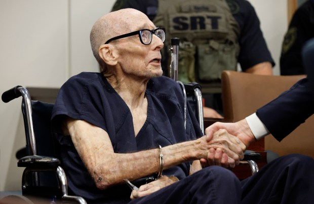 Tommy Zeigler shakes hands with his defense attorneys before an...