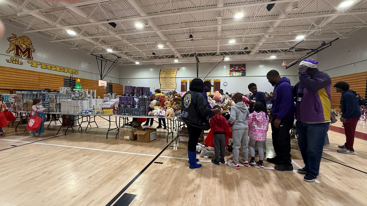 Tampa police officers helped hundreds of kids in need get toys for the holidays with the agency's annual Enchanted Wonderland event. (Spectrum News/Tyler O'Neill)