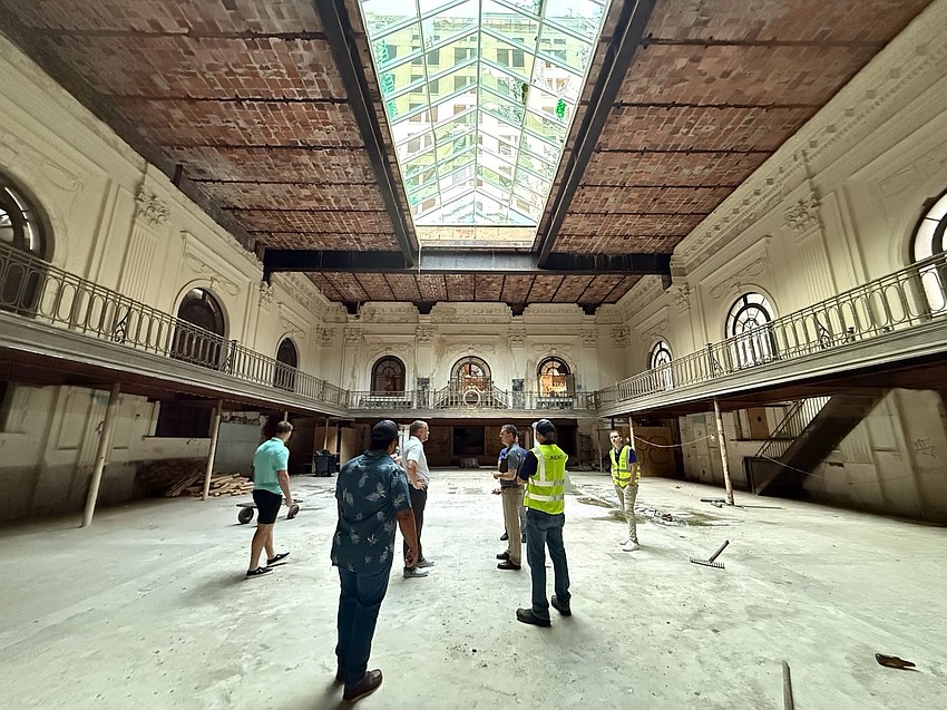 Avant Construction Group examines the interior of the Florida National Bank Building, also known as the Marble Bank, on Aug. 11. It is one-third of the Laura Street Trio in Downtown Jacksonville.