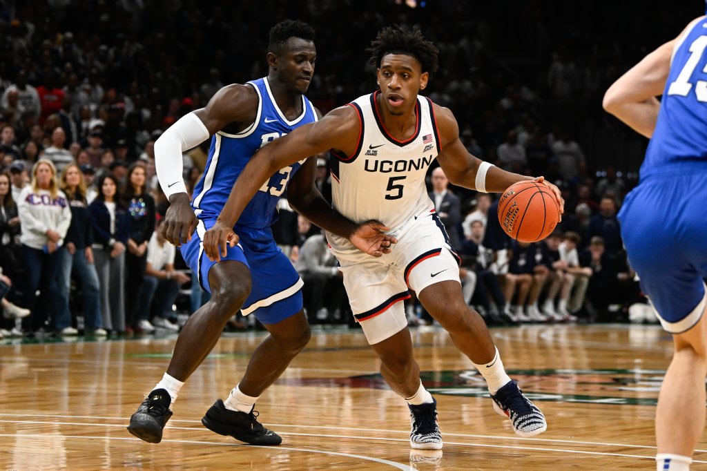 UConn Huskies forward Tarris Reed Jr. (5) drives to the basket against BYU Cougars center Keba Keita (13).