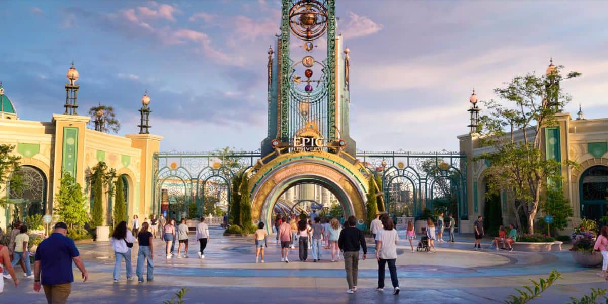 guests walk inside of the entrance for Universal's Epic Universe park