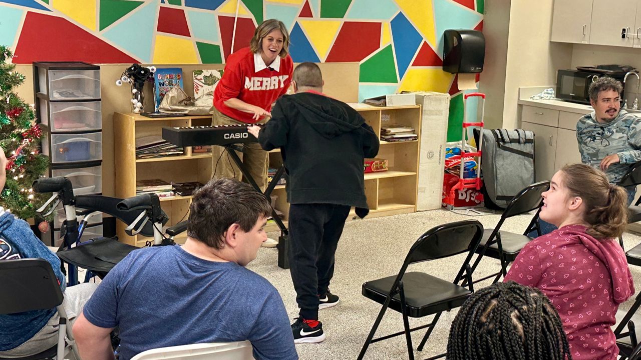 Stephanie Ansley, who created Strolling Productions alongside her husband, is now not only a fixture at places like Disney Springs — but also nonprofit OCA. (Spectrum News)