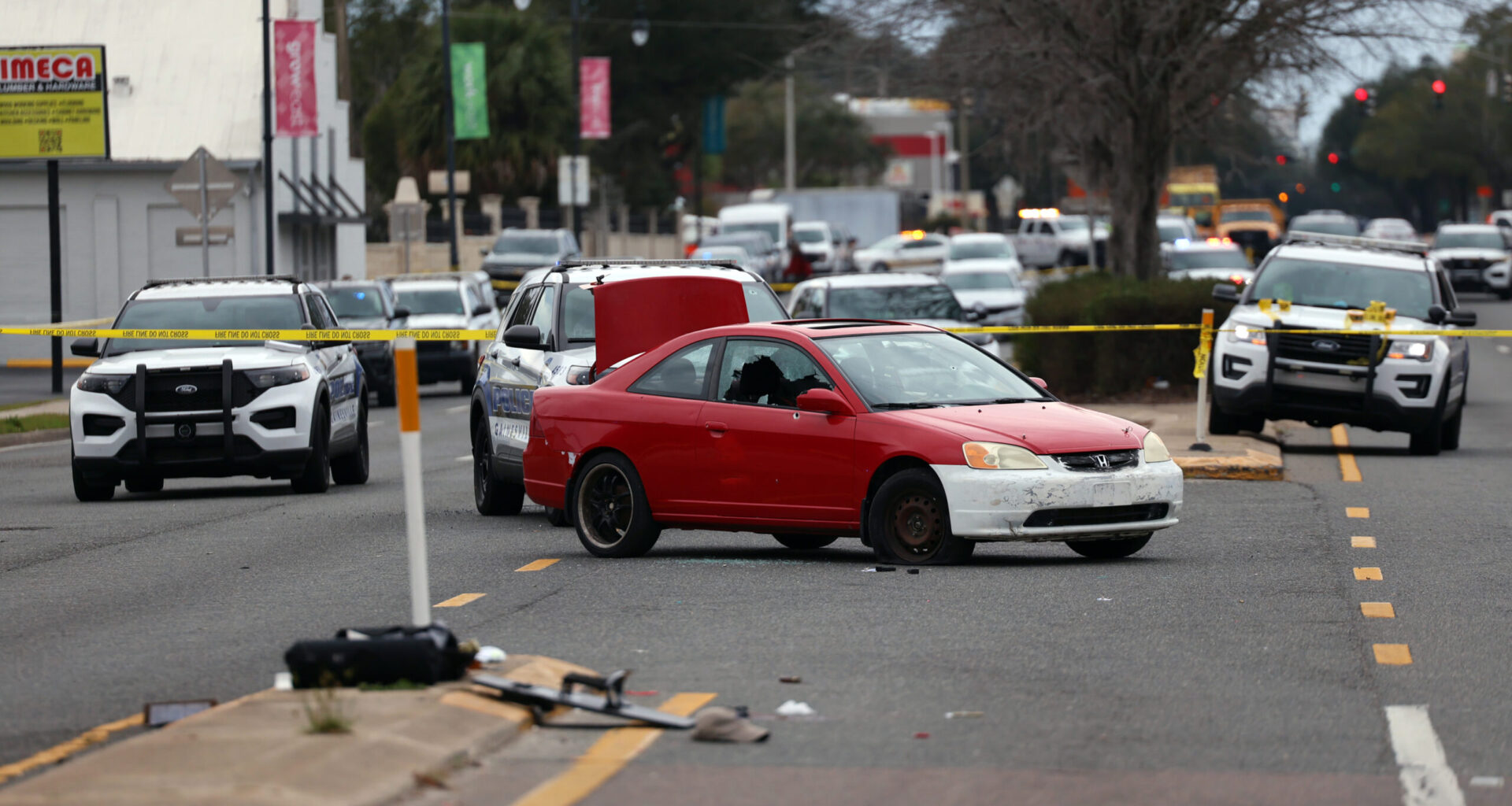 Two dead, two police officers shot after morning shootout in city streets