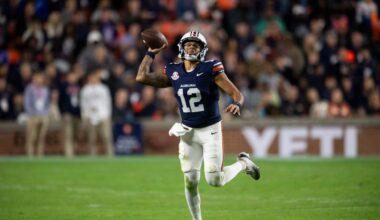 Auburn Tigers quarterback Ashton Daniels (12) pump fakes a pass as Auburn Tigers take on Kentucky Wildcats at Jordan-Hare Stadium in Auburn, Ala. on Saturday, Nov. 1, 2025. Auburn Tigers and Kentucky Wildcats are tied 3-3 at halftime.