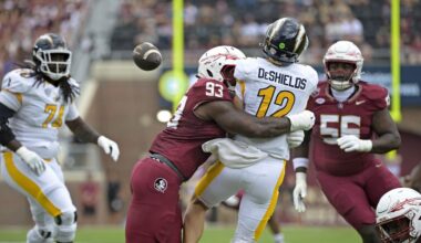 Sep 20, 2025; Tallahassee, Florida, USA; Kent State Golden Flashes quarterback Dru DeShields (12) is hit as he throws the ball by Florida State Seminoles defensive lineman Mandrell Desir (93) during the first half at Doak S. Campbell Stadium. Mandatory Credit: Melina Myers-Imagn Images