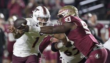 Nov 15, 2025; Tallahassee, Florida, USA; Virginia Tech Hokies quarterback Kyron Drones (1) has the ball knocked away by Florida State Seminoles defensive lineman Mandrell Desir (93) during the second half at Doak S. Campbell Stadium. Mandatory Credit: Melina Myers-Imagn Images