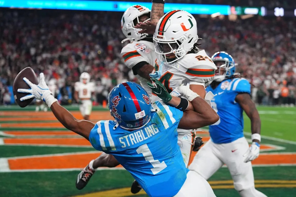 Mississippi Rebels wide receiver De’zhaun Stribling (1) attempts to make a catch against Miami Hurricanes defensive back Ethan O’Connor (24) in the second half during the 2026 Fiesta Bowl and semifinal game of the College Football Playoff. IMAGN IMAGES via Reuters Connect
