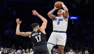 Orlando Magic's Paolo Banchero (5) shoots a game winning three-point shot over Brooklyn Nets' Michael Porter Jr. (17) during the overtime of an NBA basketball game Wednesday, Jan. 7, 2026, in New York. (AP Photo/Frank Franklin II)