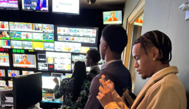 Joel Mitchell captures and manages digital content while working behind the scenes during a live broadcast production.