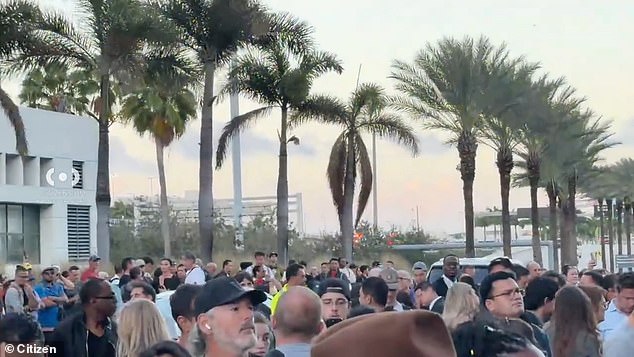 Travelers were seen crowded outside of Miami International Airport on Sunday evening following an evacuation due to a 'safety issue'
