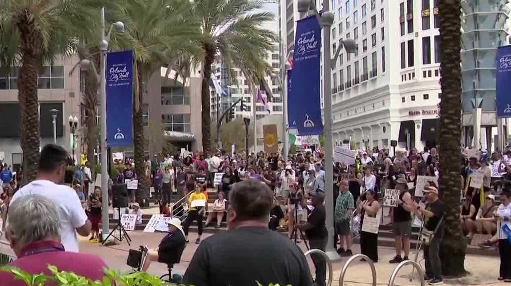 Hundreds rally outside Orlando City Hall in protest of ICE