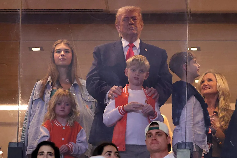 President Donald Trump, accompanied by his eldest daughter Ivanka and granddaughter Kai, got a thunderous reception at the College Football Playoff national championship game in Miami Monday night (Getty Images)