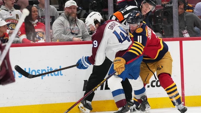 Colorado Avalanche defenseman Samuel Girard (49) and Florida Panthers right...