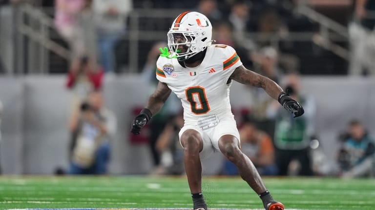 Miami defensive back Keionte Scott drops back to defend against...