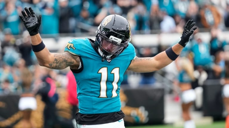 Jacksonville Jaguars wide receiver Parker Washington (11) celebrates his touchdown...