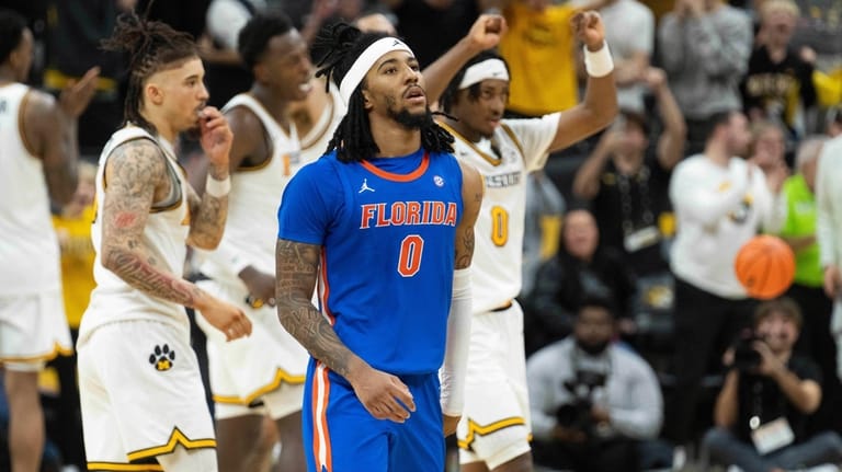 Florida's Boogie Fland (0) grimaces after missing the last shot...
