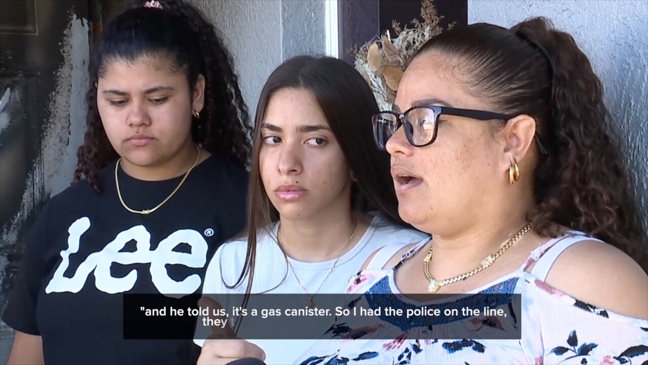 The Álvarez family speaking with reporters after the fire. 