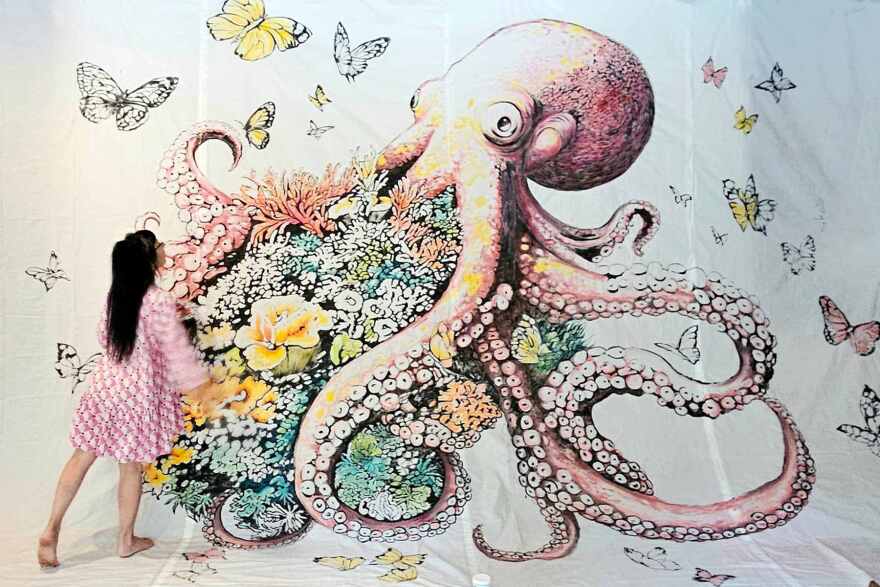 Cape Coral artist Mariapia Malerba paints mural 'I Am My Home' which greets visitors to BIG ARTS on Sanibel Island.