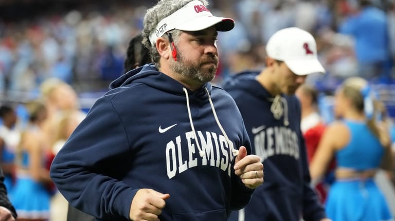 Mississippi head coach Pete Golding runs on the field at...