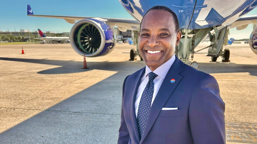 Tampa International Airport CEO Michael Stephens smiles to camera as plane is in the background