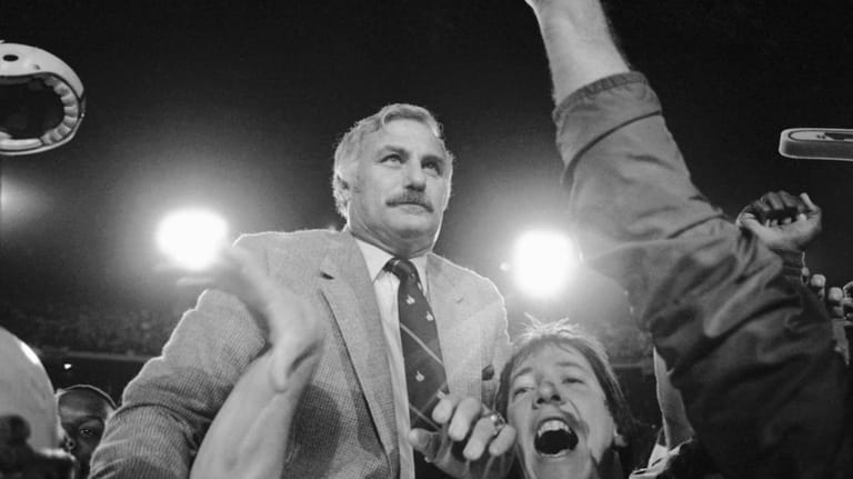 FILE -University of Miami's coach Howard Schnellenberger is carried from...