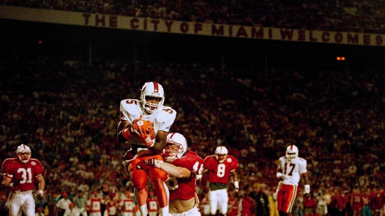 FILE -Miami wide receiver Kevin Williams (5) cradles a Gino...
