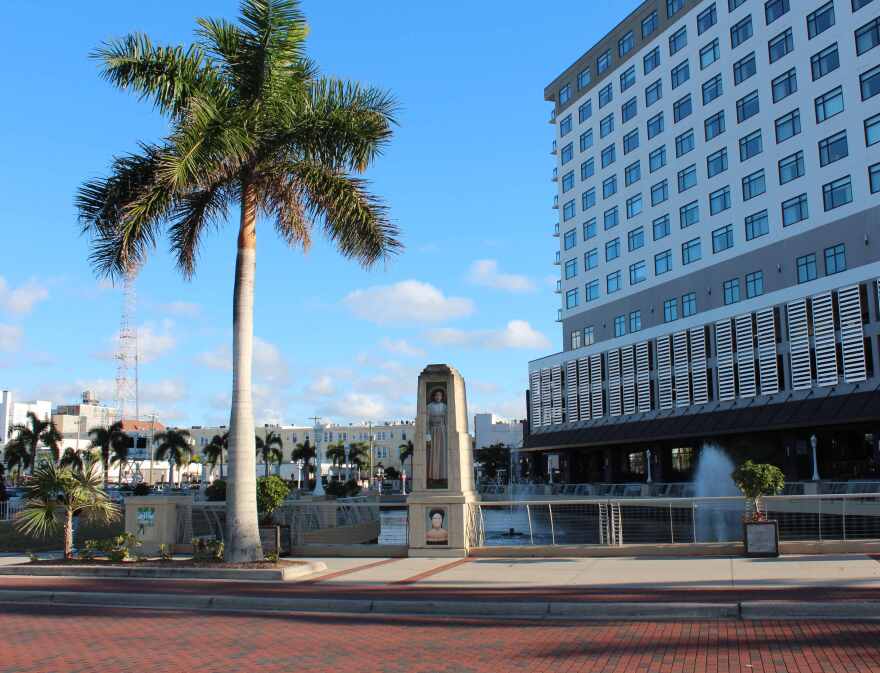 Mural of Dr. Ella Mae Piper is located on obelisk on south side of Edwards Avenue near entrance to Luminary Hotel.
