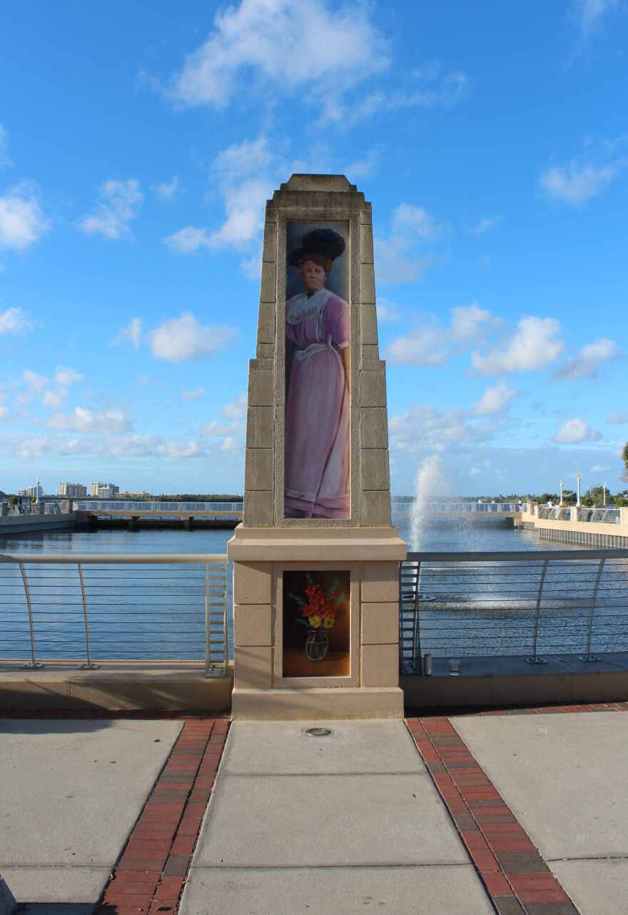 Mural of early pioneer Tootie McGregor Terry is located on obelisk on north side of Edwards Ave at the downtown Fort Myers river basin.