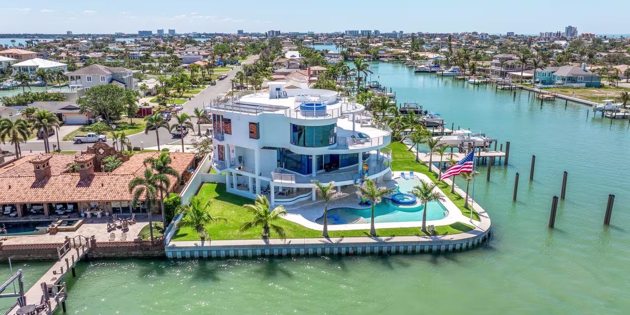 ‘Blastproof’ Curving Glass Mansion on Treasure Island, Florida, Heads to Auction