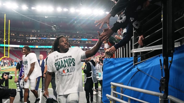 Miami wide receiver Malachi Toney leaves the field after the...