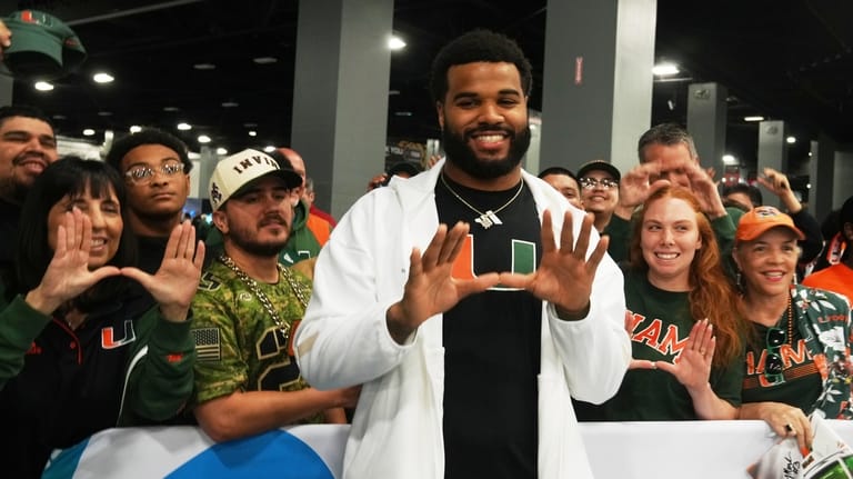 Miami defensive lineman Akheem Mesidor speaks during media day ahead...