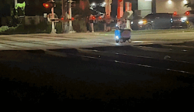 Train strikes food delivery robot stuck on railroad tracks in Miami
