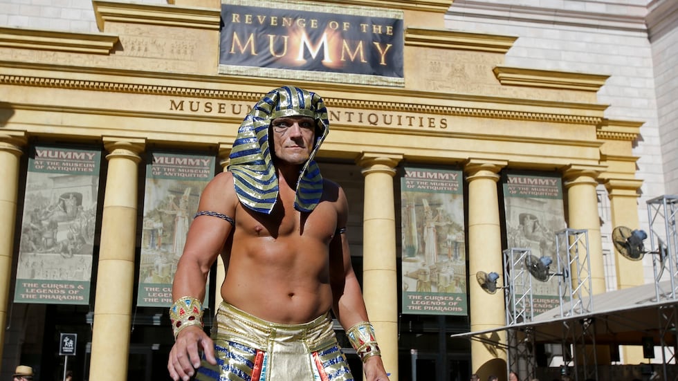 FILE -- In this Thursday, Oct. 22, 2015 photo, a character actor greets visitors at the...