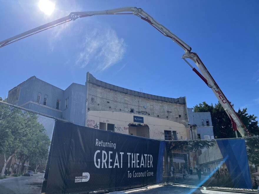 Construction workers used a concrete boom pump on Monday to place concrete around the exterior of the playhouse facade.