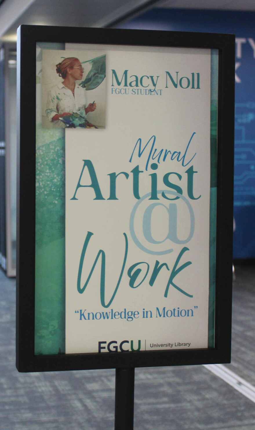 'Artist at Work' signage inside FGCU Bradshaw Library.