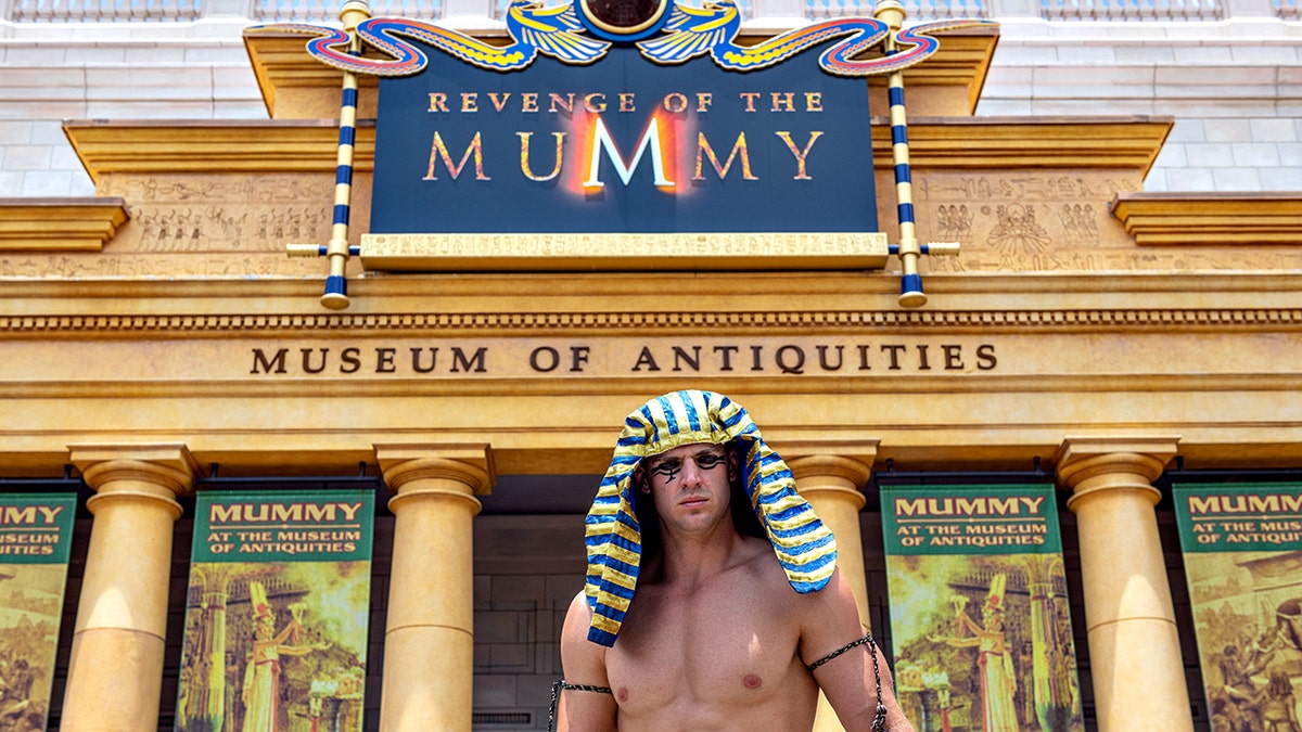 Male entertainer outside the 'Revenge of the Mummy' amusement park ride