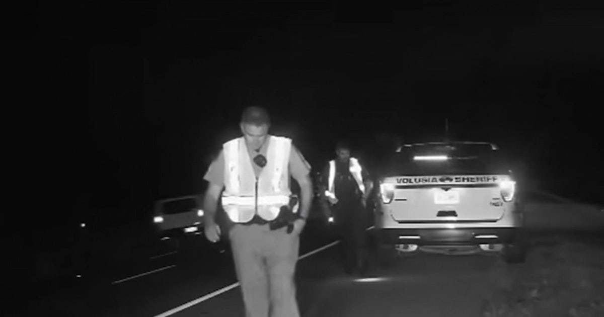 Video: Florida trooper, deputy leap to safety as driver sideswipes patrol vehicles on I-95