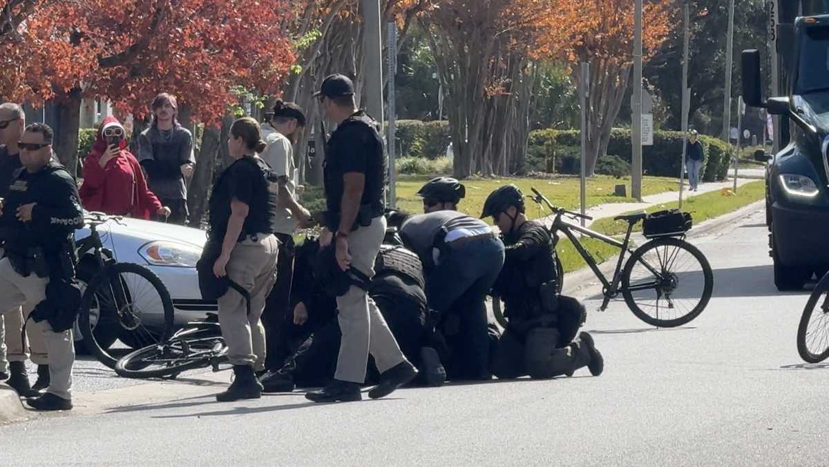 Protester detained during rally outside ICE facility in Orlando