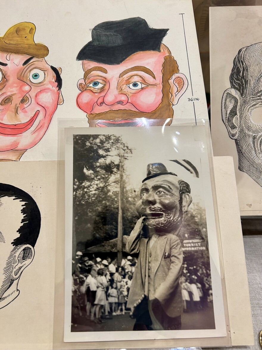 Illustrations and a black and white photo of grotesque heads at the Henry B. Plant Museum's "Gaspar’s Gold: Carnival and Community in a New South City" exhibit.