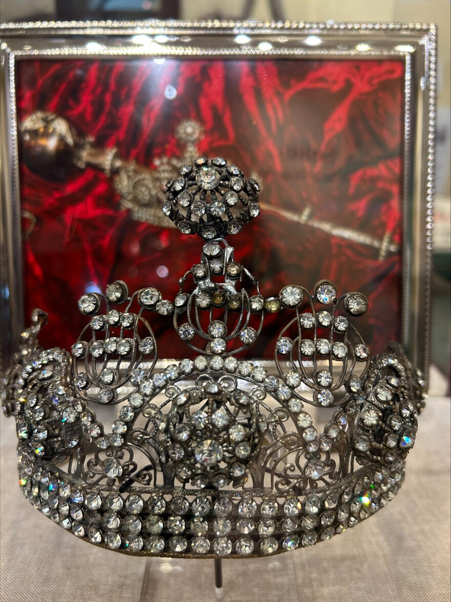 Crown displayed in glass case 