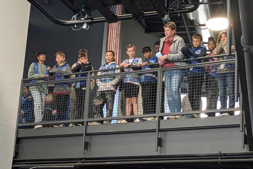 These youngsters were about to embark on a simulated space journey when they paused to watch the Challenger Center's anniversary ceremony.