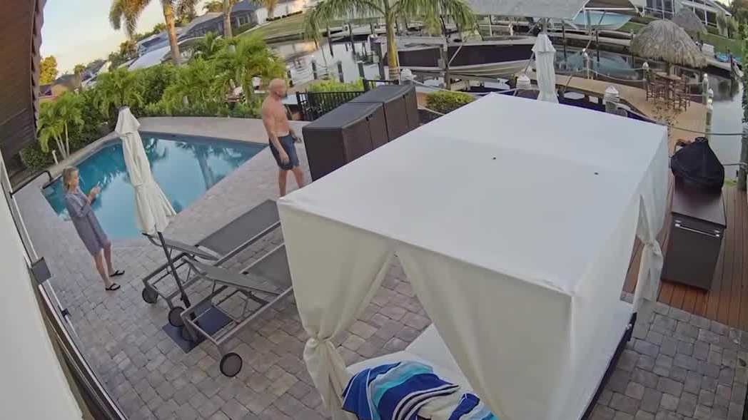 Couple caught on camera lurking in Florida family's backyard