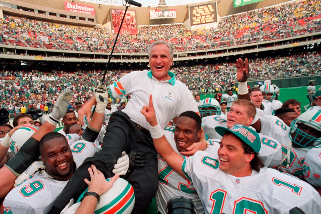 Miami Dolphins coach Don Shula is carried on his team's shoulders after his 325th victory.