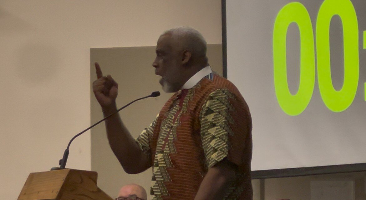 At least 100 people showed up to Fleming Island High to express their outrage. Here, Saint James AME Church Rev. Jeffrey Dove speaks at the podium.